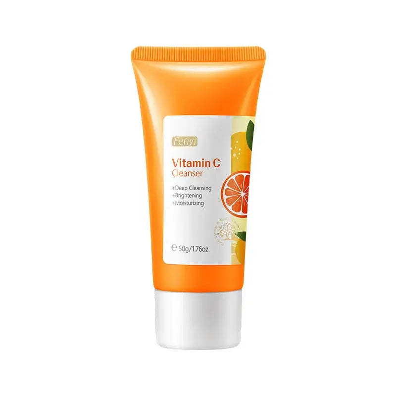 Orange tube of Vitamin C cleanser with citrus fruit imagery.