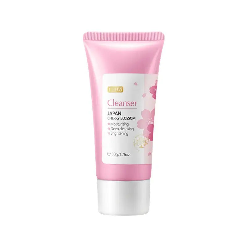 Pink tube of facial cleanser with cherry blossom design.