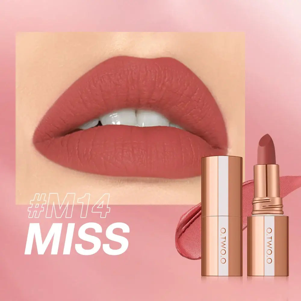 Close-up of plump, coral-colored lips wearing matte lipstick.