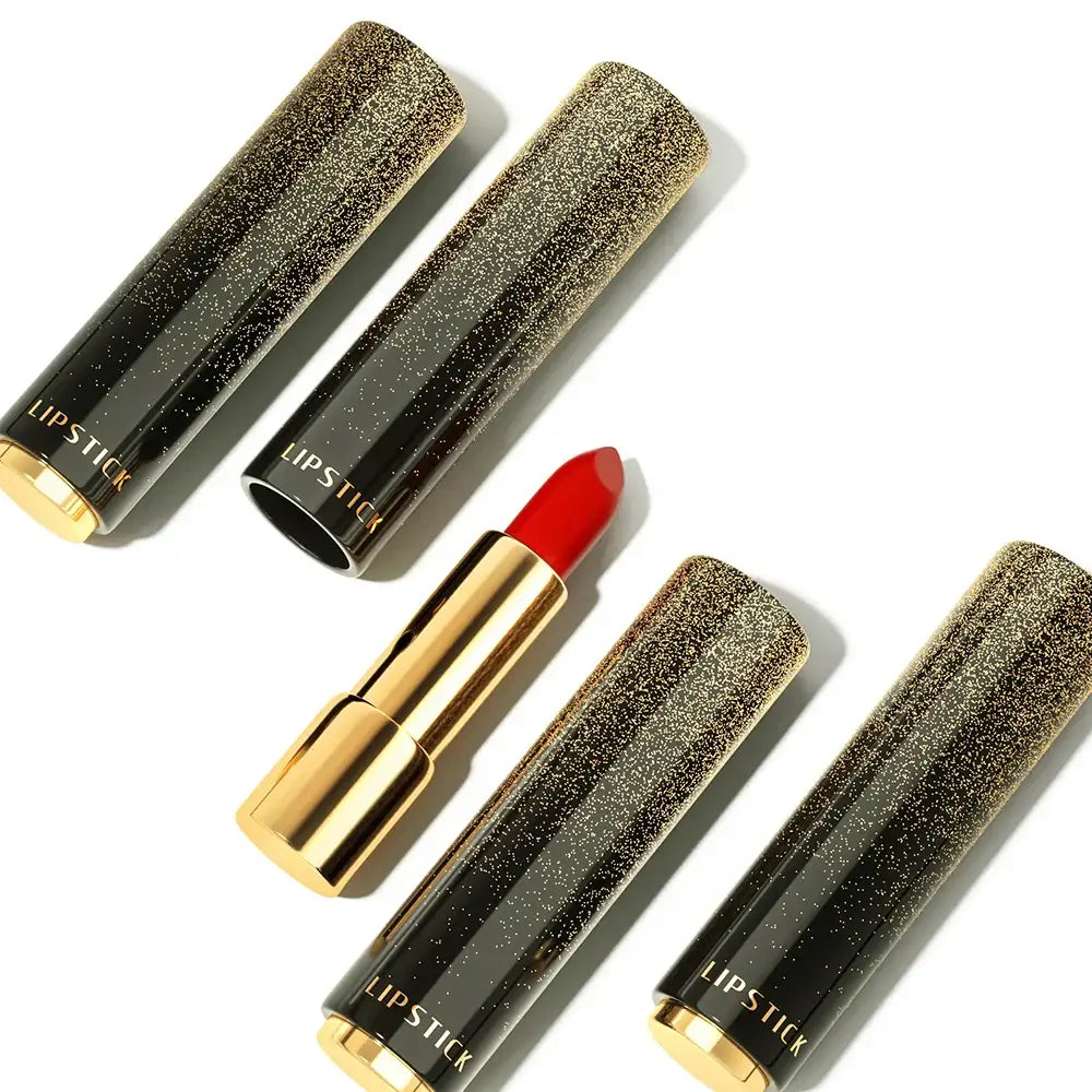 Bright red lipstick in a gold tube surrounded by four glittery black lipstick cases.