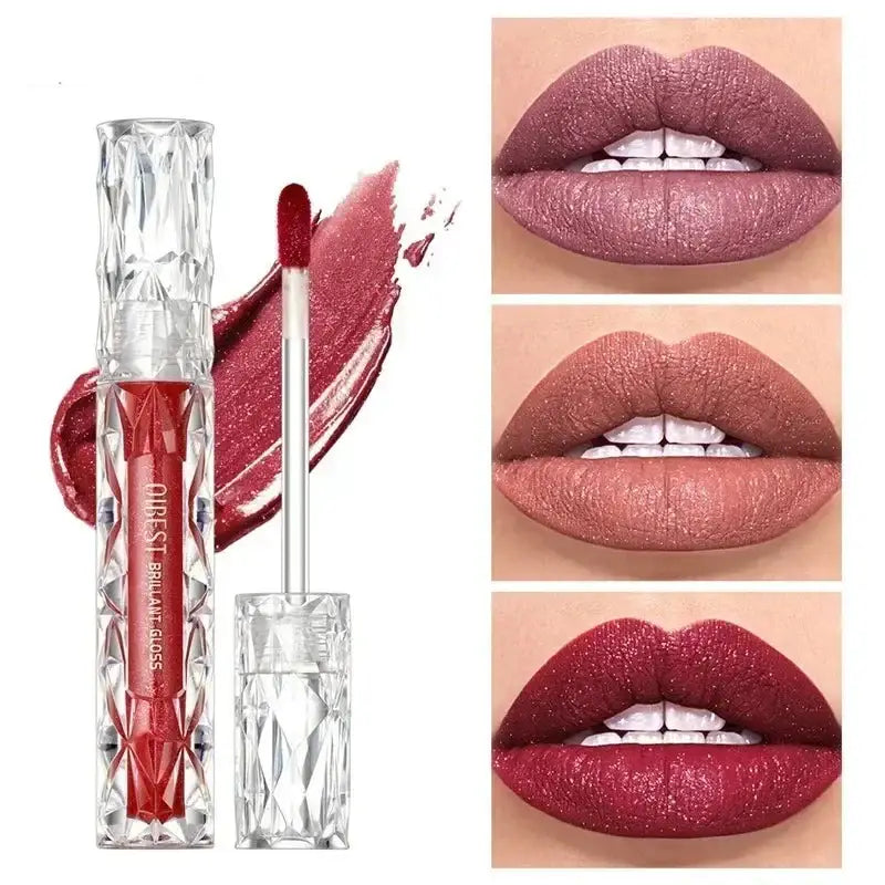 Lip gloss in a clear, faceted tube with a red applicator wand.