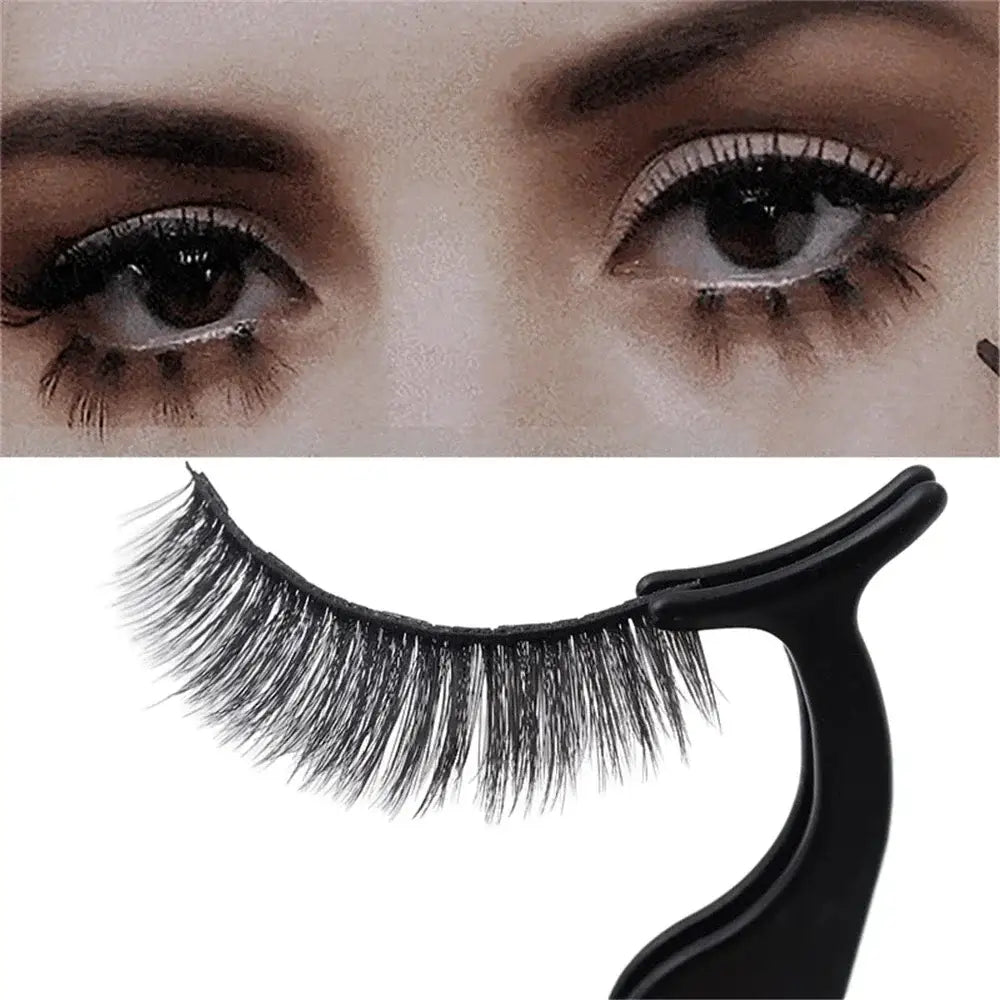 False eyelash with an applicator tool.