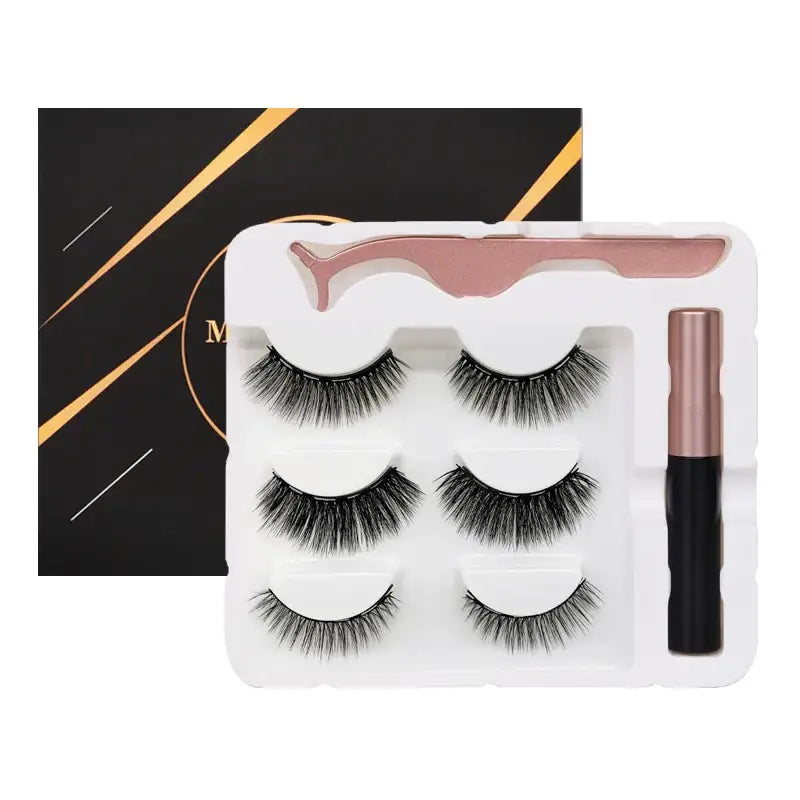 Set of three pairs of false eyelashes with an eyelash applicator tool.