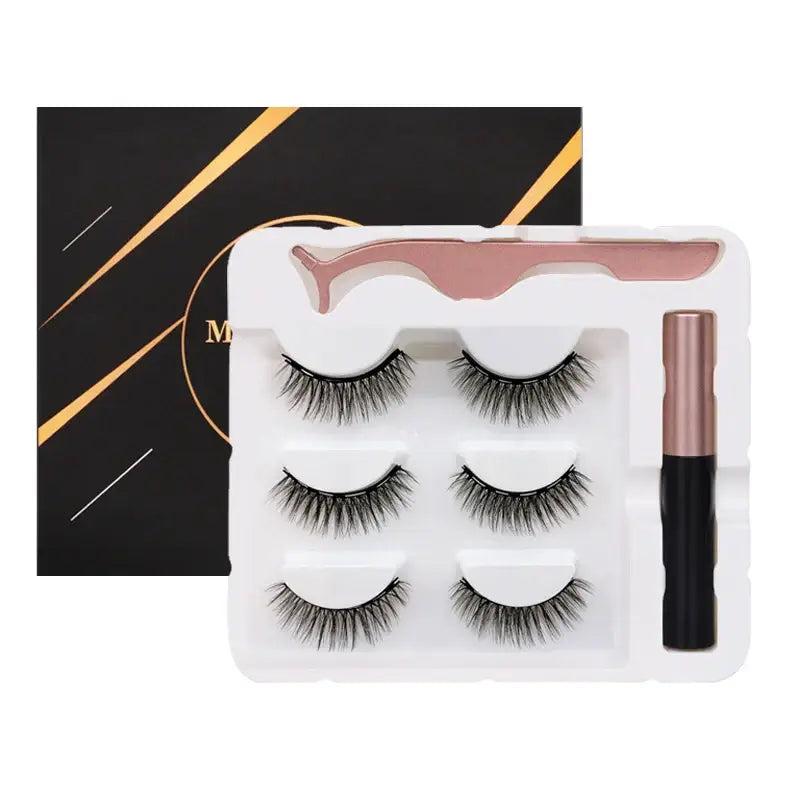 Set of three pairs of false eyelashes with an eyeliner or adhesive applicator.