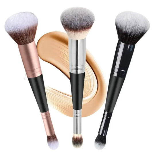 Set of makeup brushes with different handles and bristle shapes alongside a swirl of foundation.