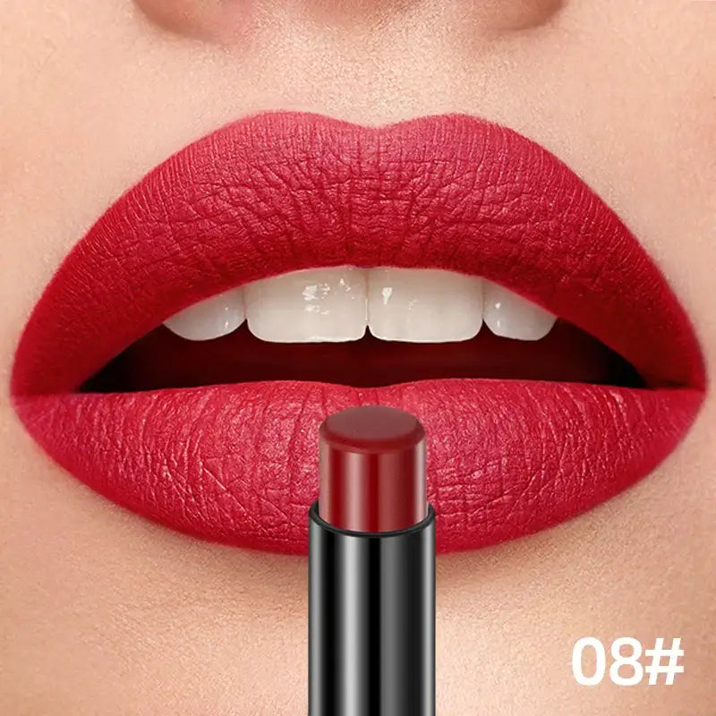 Bright red lipstick applied to lips with a matching lipstick tube below.