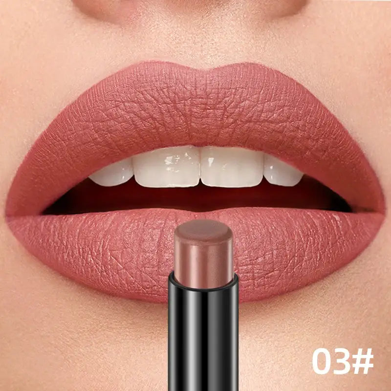 Close-up of lips wearing pink-mauve lipstick with a matching lipstick tube below.