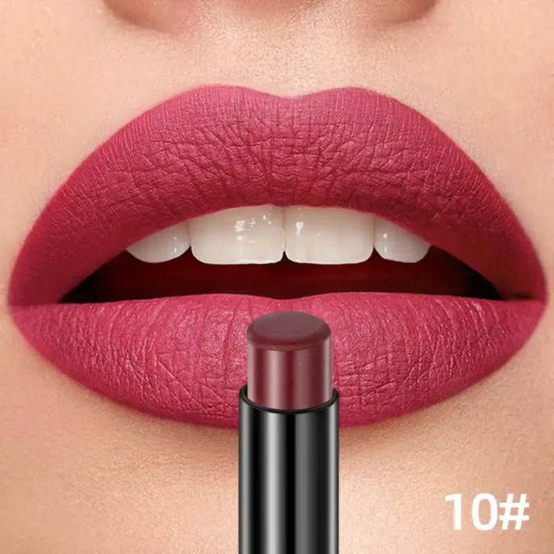 Vibrant pink lipstick applied to lips with a matching lipstick tube below.