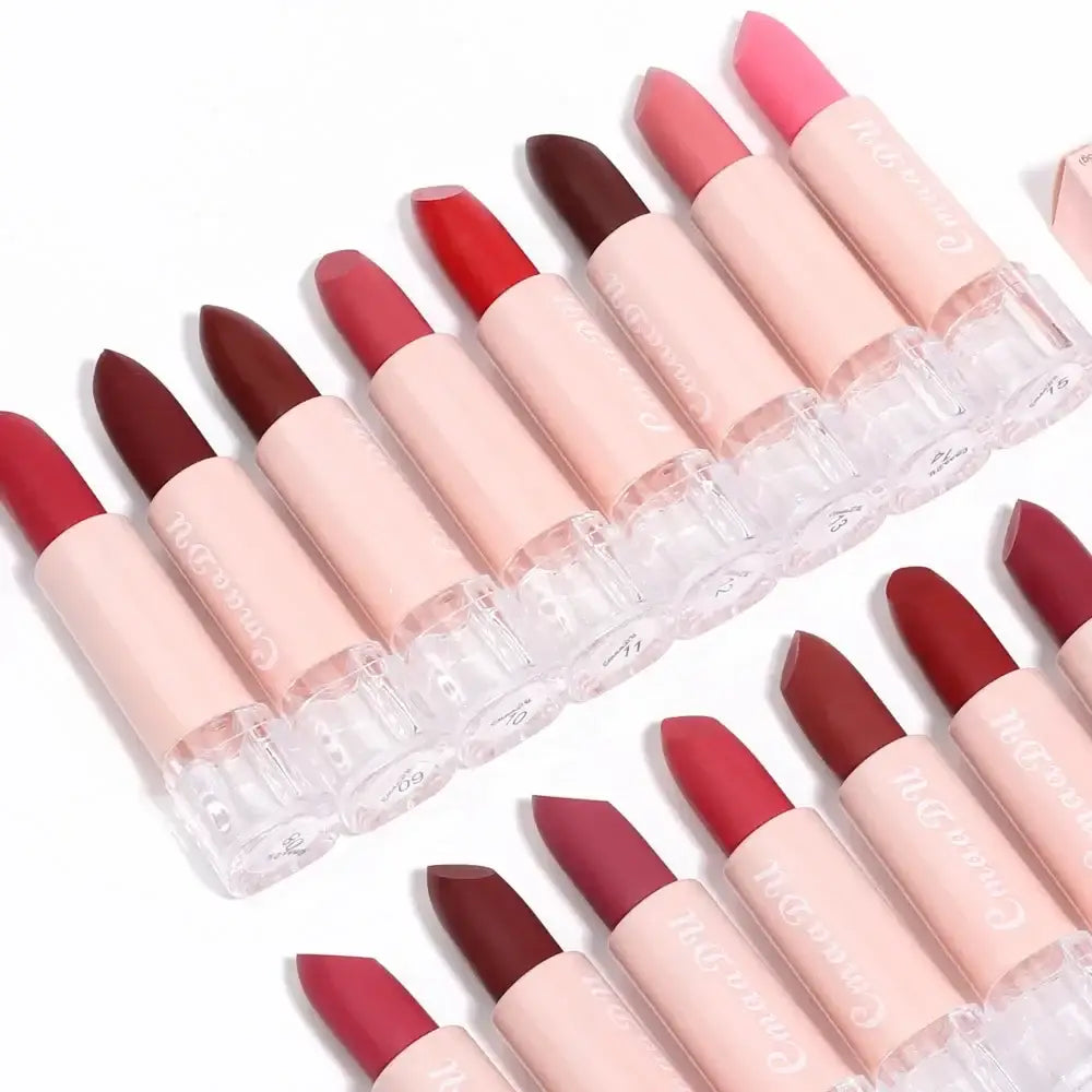 Collection of lipsticks in various shades of pink and red.