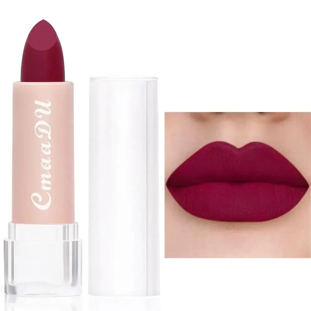 Lipstick in a light pink tube with a deep burgundy color.