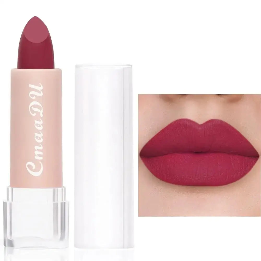 Lipstick in a pale pink tube with a deep red color.