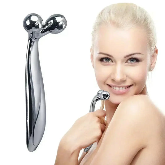 Metallic handheld facial massage tool with two spherical ends.