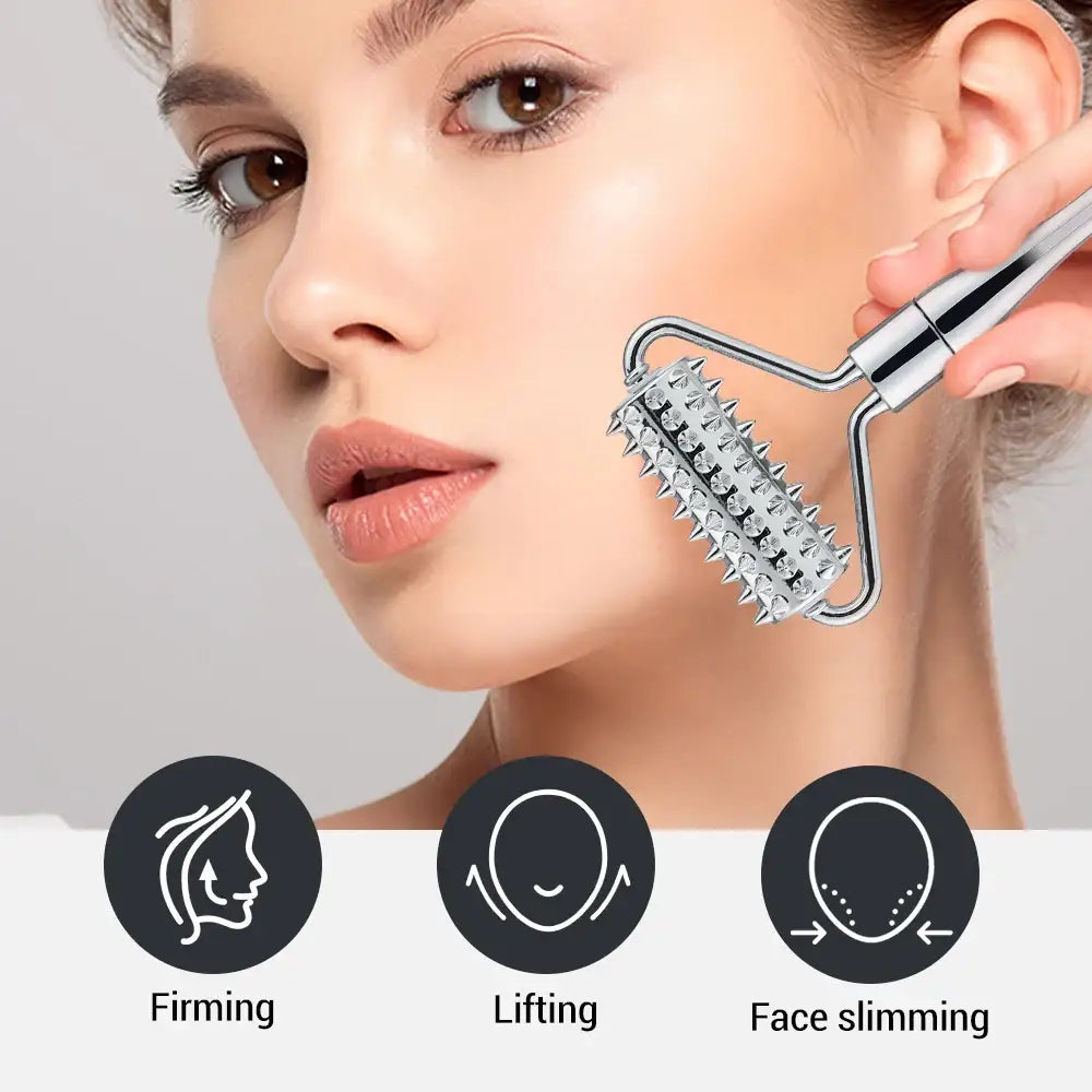 Facial massage roller with metal spikes being used on a person’s cheek.