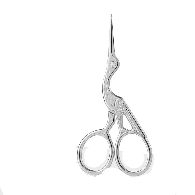 Ornate scissors shaped like a stork or heron.