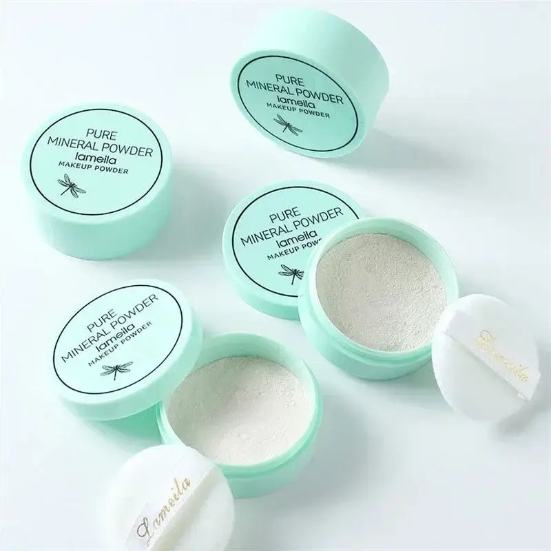 Mint green containers of pure mineral powder makeup with white lids.