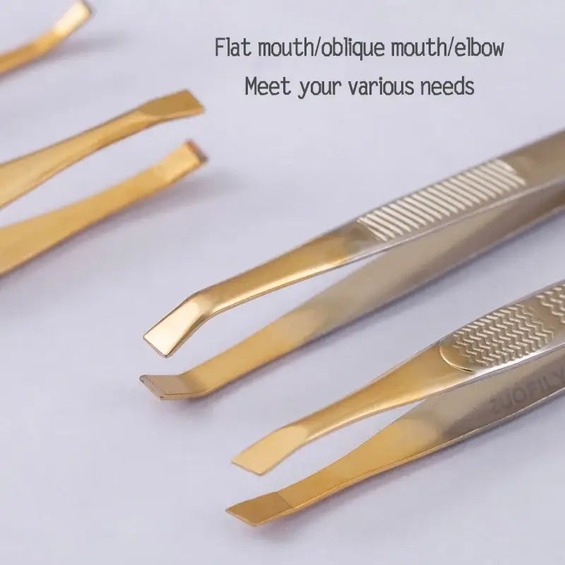 Set of gold-colored tweezers with different tip shapes.