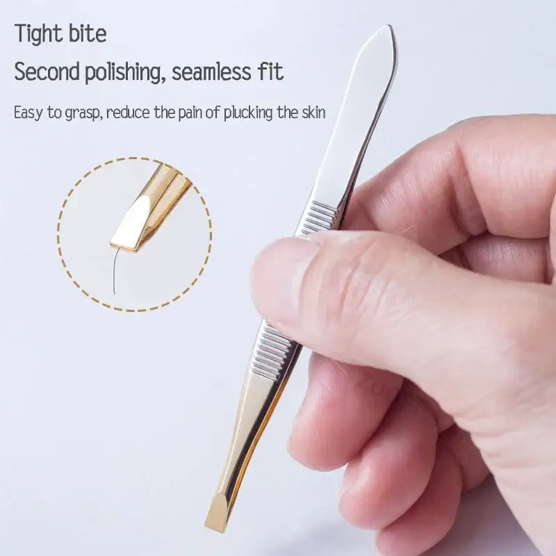 Precision tweezers with a gold-colored tip and textured grip held by a hand.