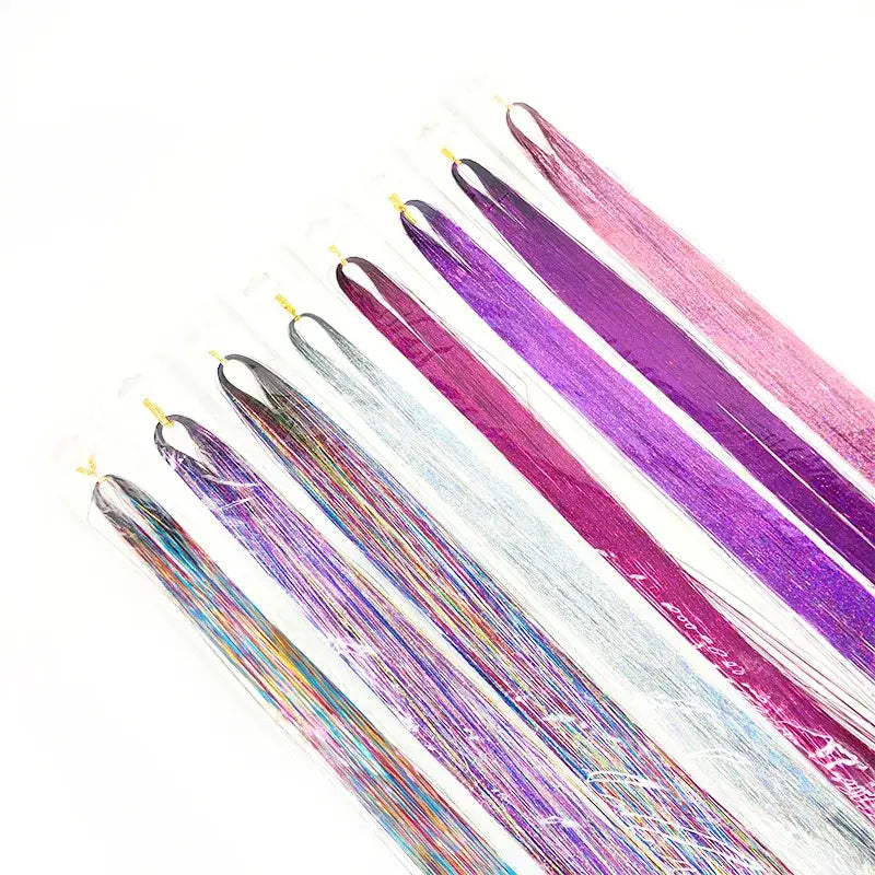 Colorful hair extensions or clip-in hair pieces arranged in a fan-like pattern.