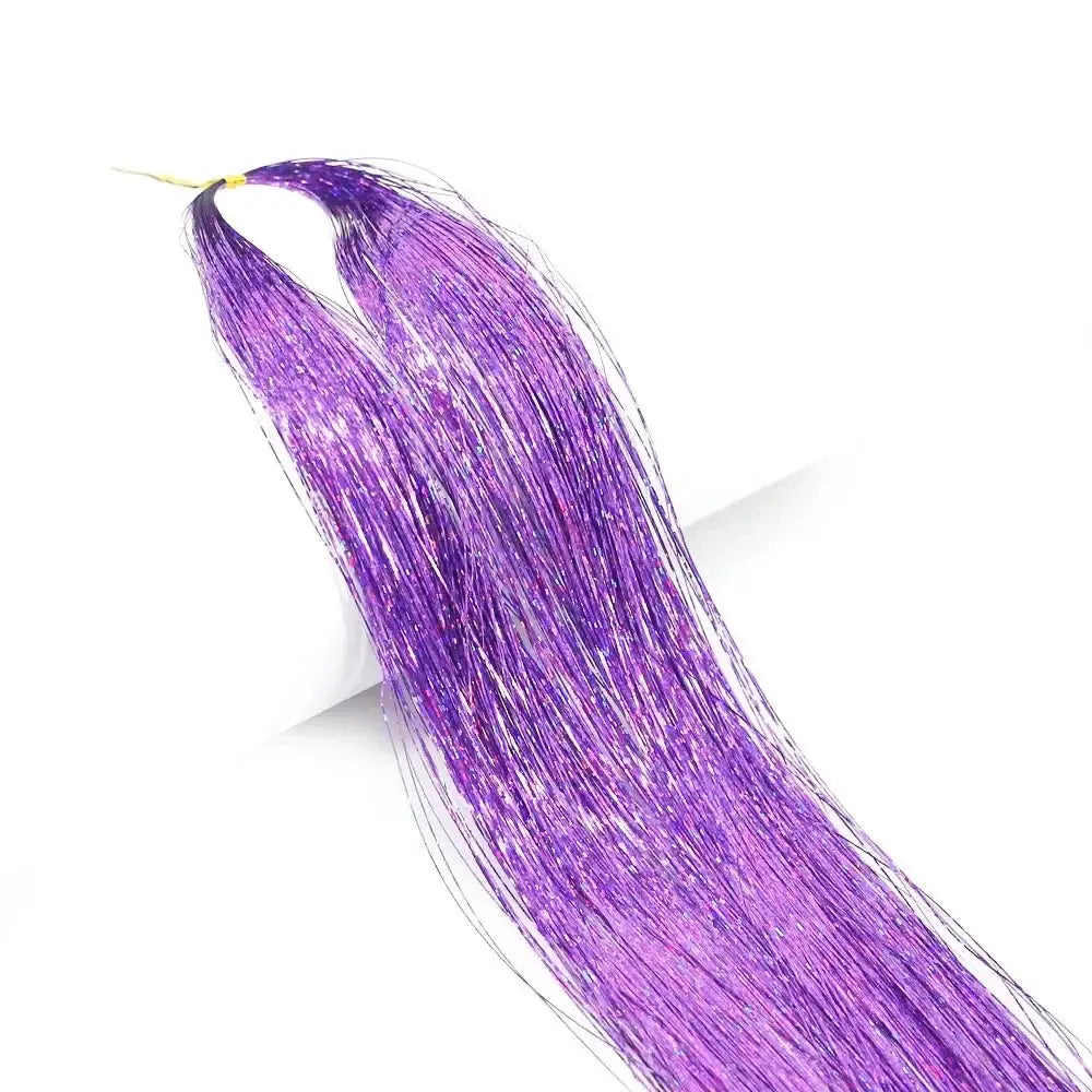 Strand of shimmering purple hair or fiber.