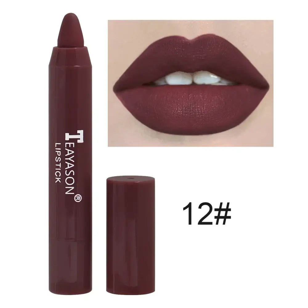 Deep burgundy lipstick in crayon form with matching lip swatch.