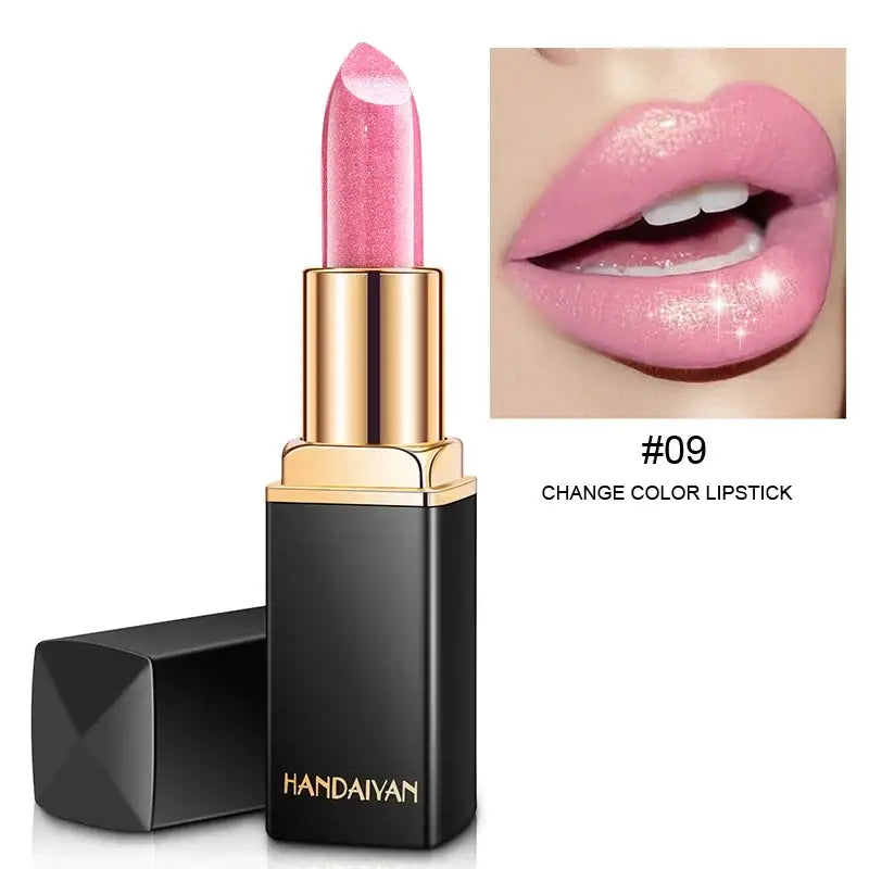 Pink lipstick in a black and gold tube.