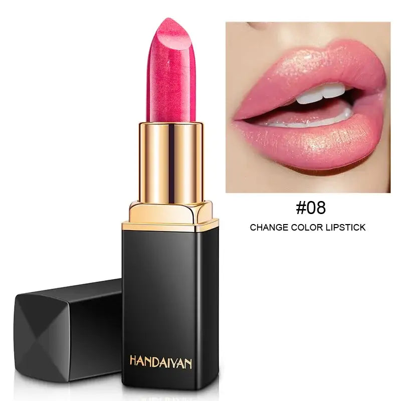 Pink lipstick in a black and gold tube.