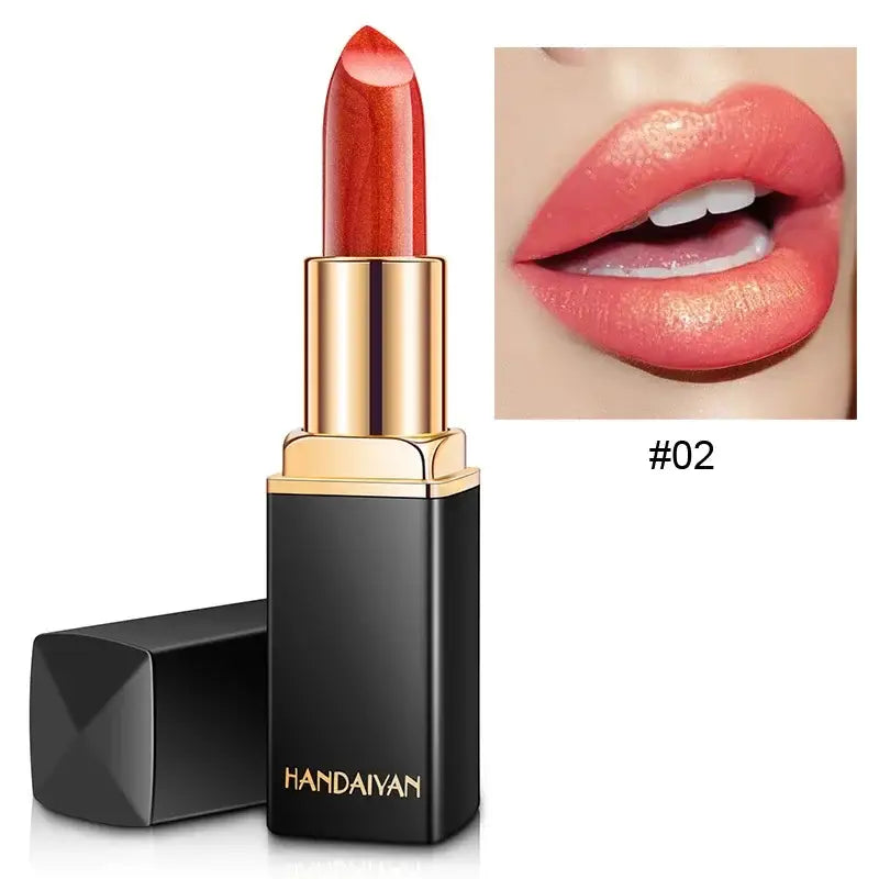 Bright red lipstick in a black and gold tube.