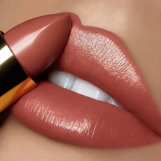 Glossy, plump lips with a nude pink lipstick being applied.