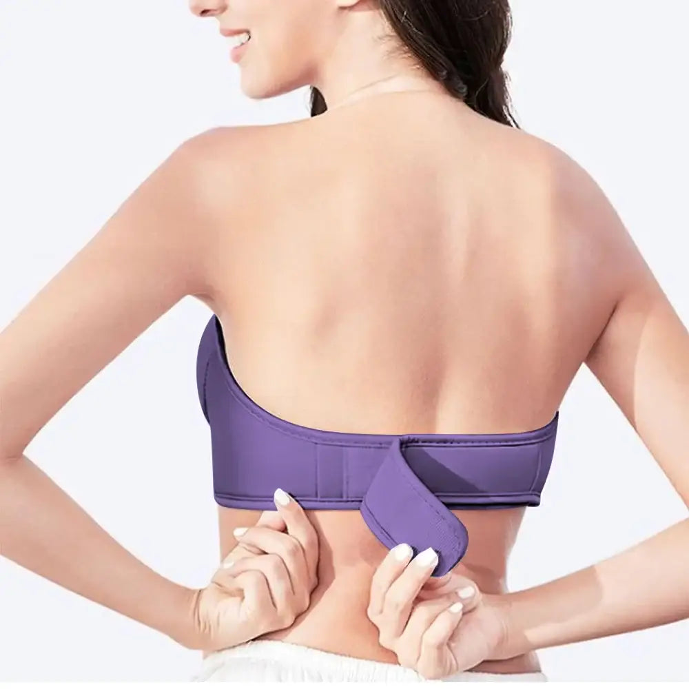 Purple strapless sports bra or athletic top being adjusted by the wearer.