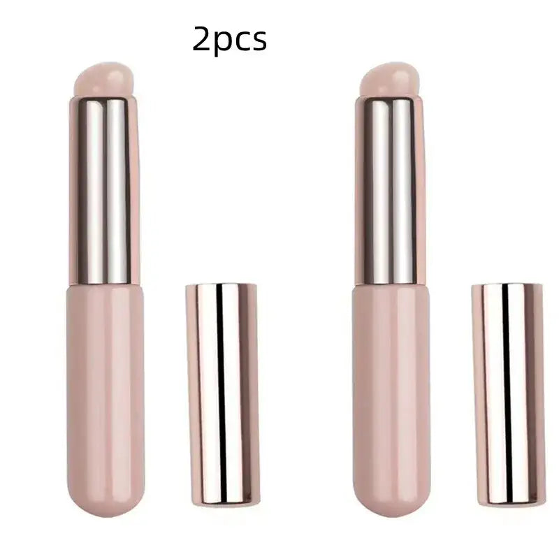 Pair of pink and metallic lipstick tubes.