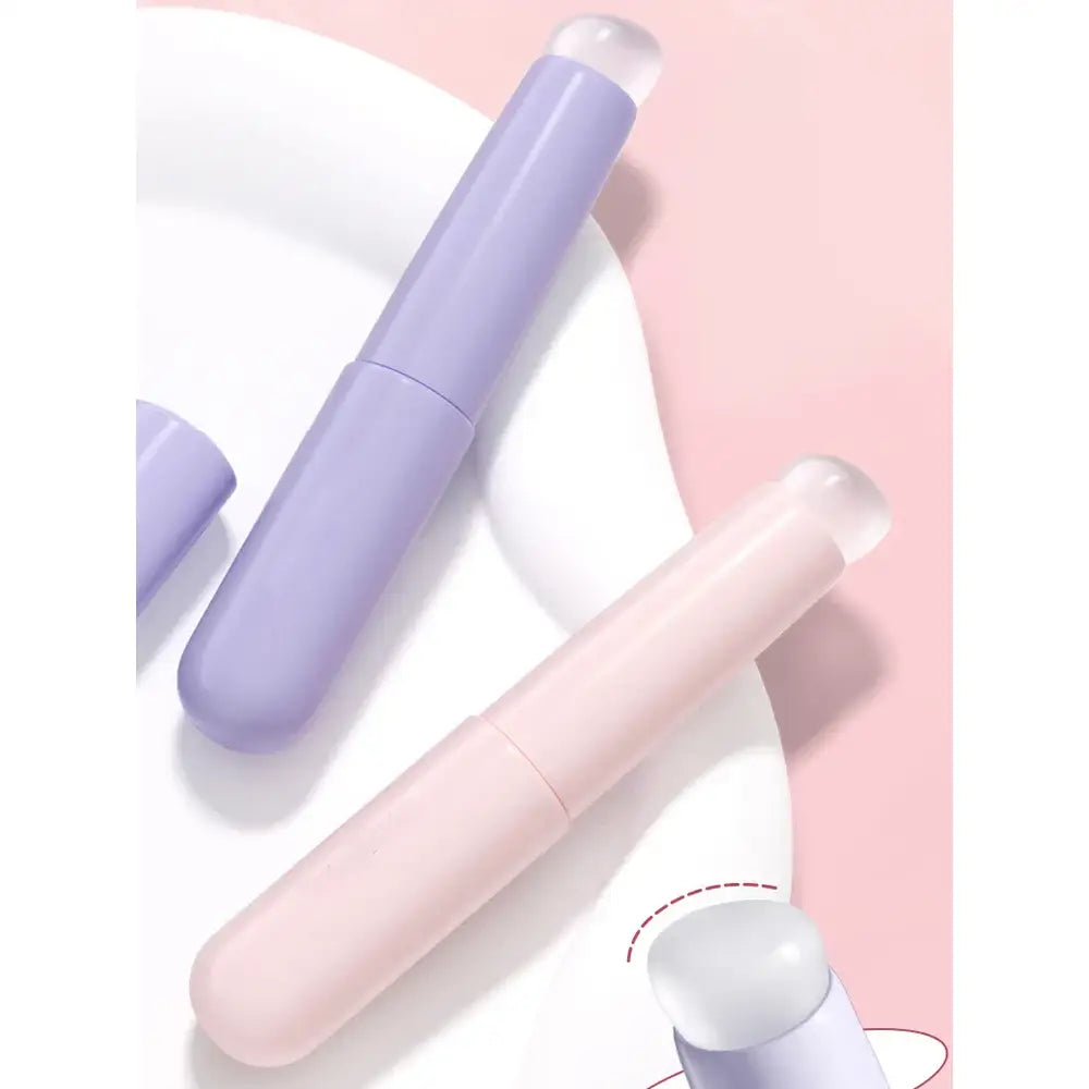 Pastel-colored cylindrical cosmetic or skincare product tubes.