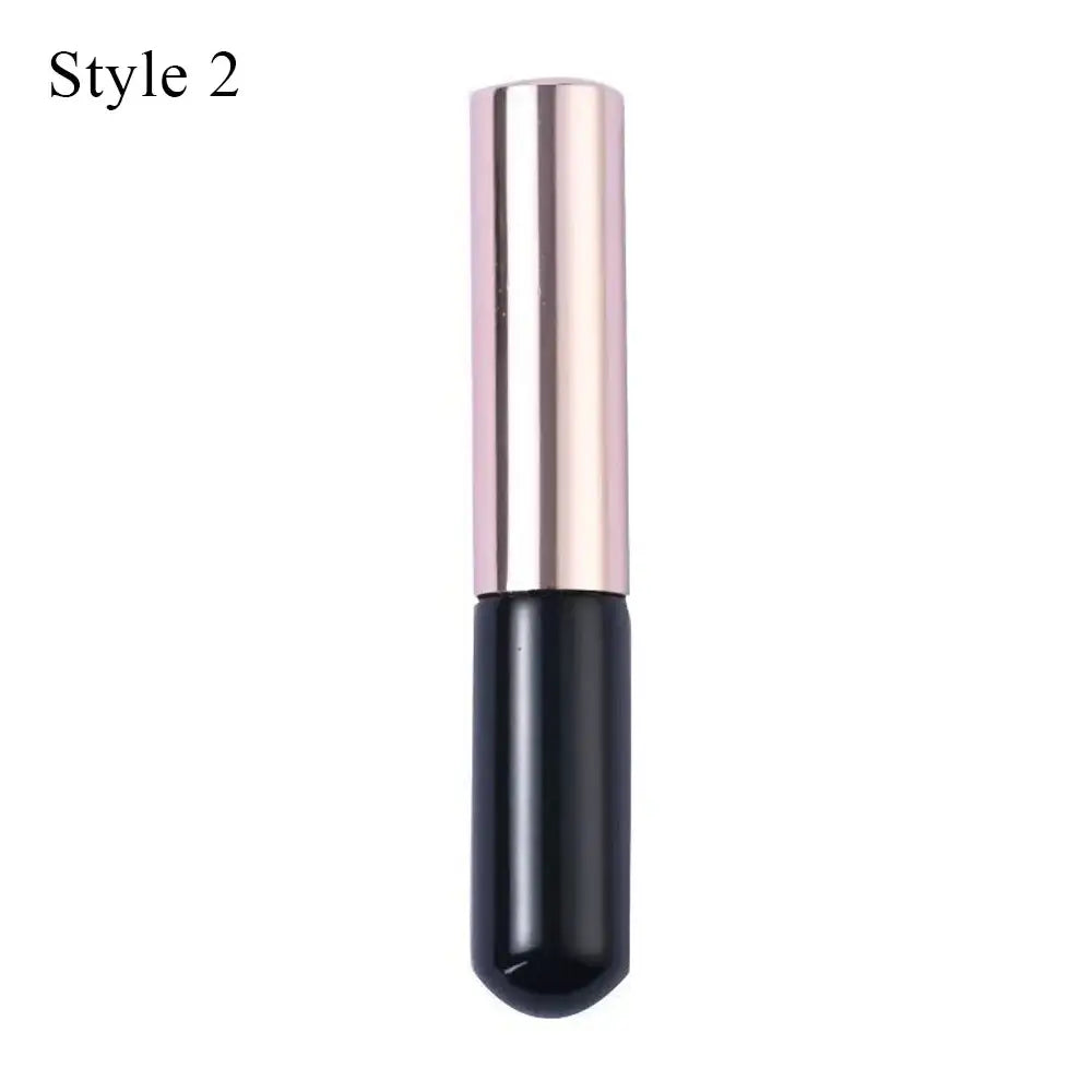 Sleek two-tone lipstick tube with a metallic pink top and black base.