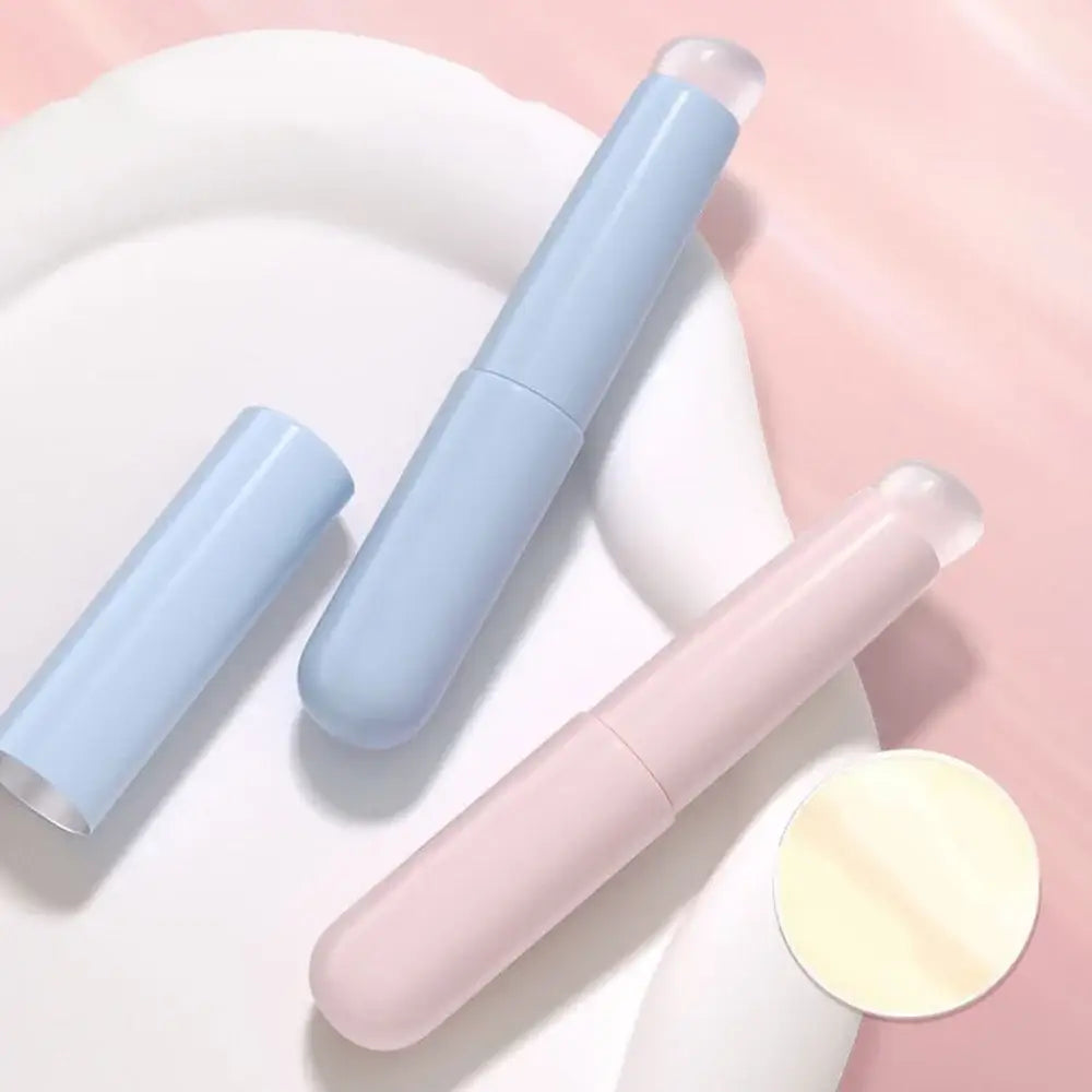 Tampons in pastel blue and pink colors alongside a small round object.