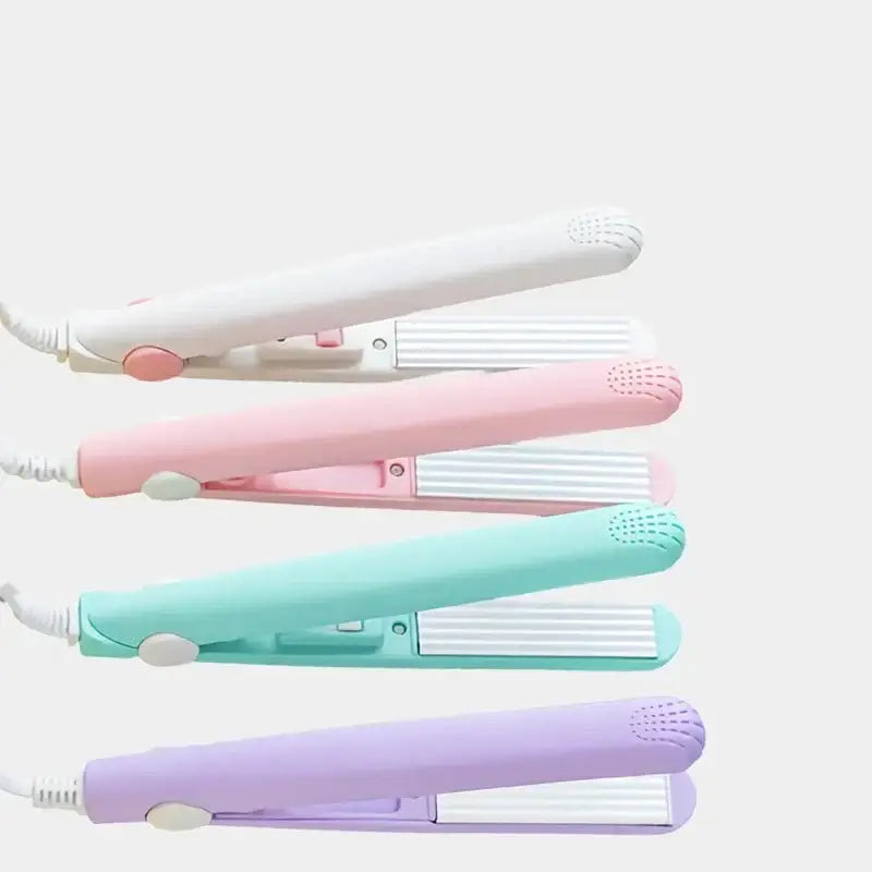 Set of pastel-colored hair straighteners or flat irons in white, pink, mint green, and lavender.