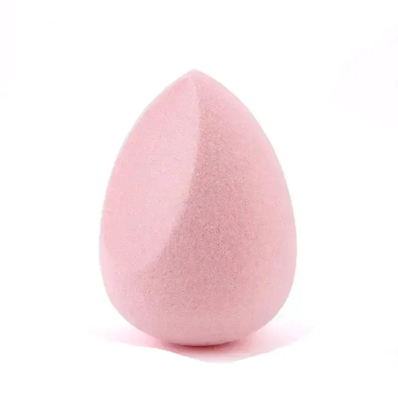 Pink teardrop-shaped makeup sponge.