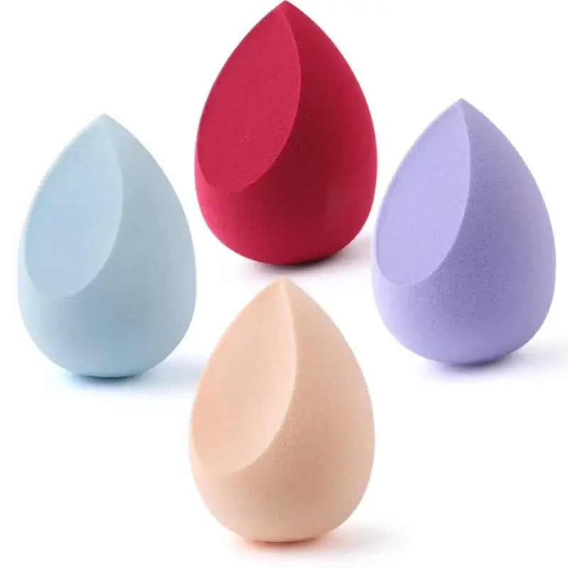 Teardrop-shaped makeup sponges in various pastel colors.