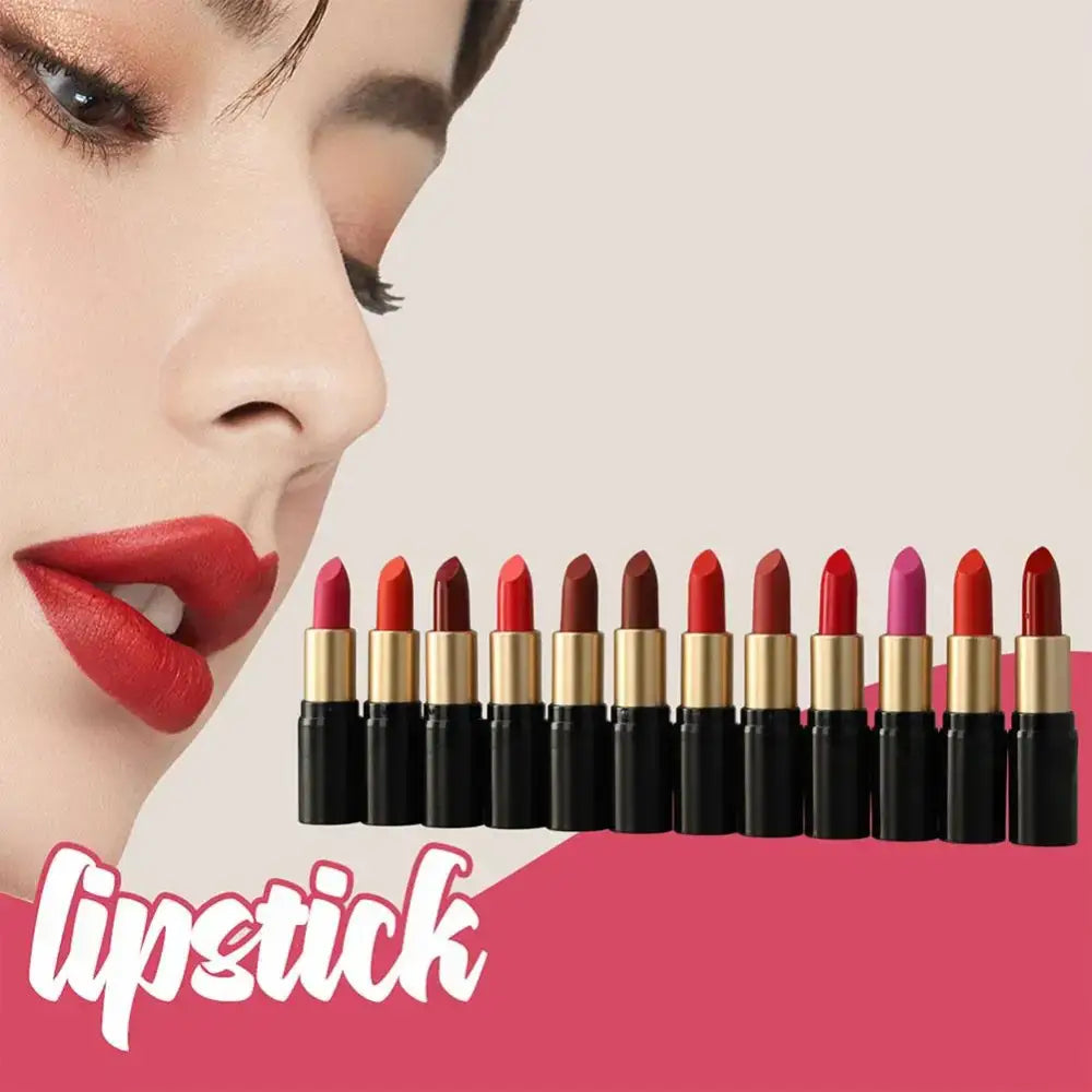 Row of lipsticks in various shades of red and pink with gold tubes.