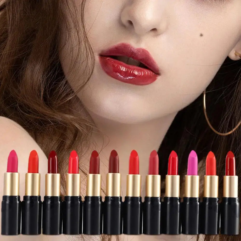 Vibrant red lipstick on lips above a row of colorful lipstick tubes.