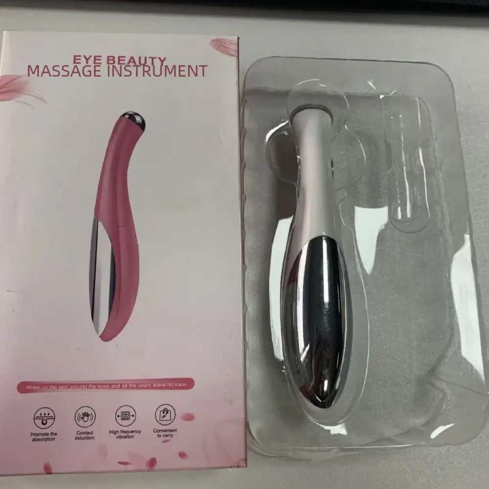 Eye beauty massage instrument with a sleek, elongated design in pink and silver colors.