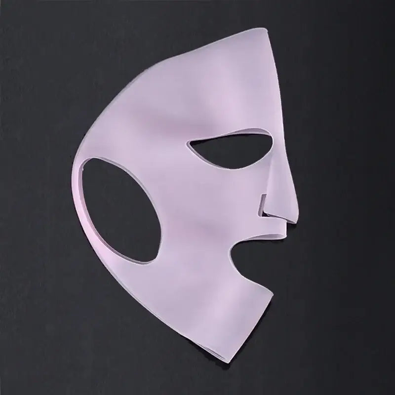 Pale pink theatrical half-mask with stylized facial features.