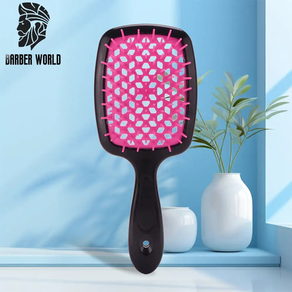 Pink and black paddle hairbrush with a wide rectangular head.