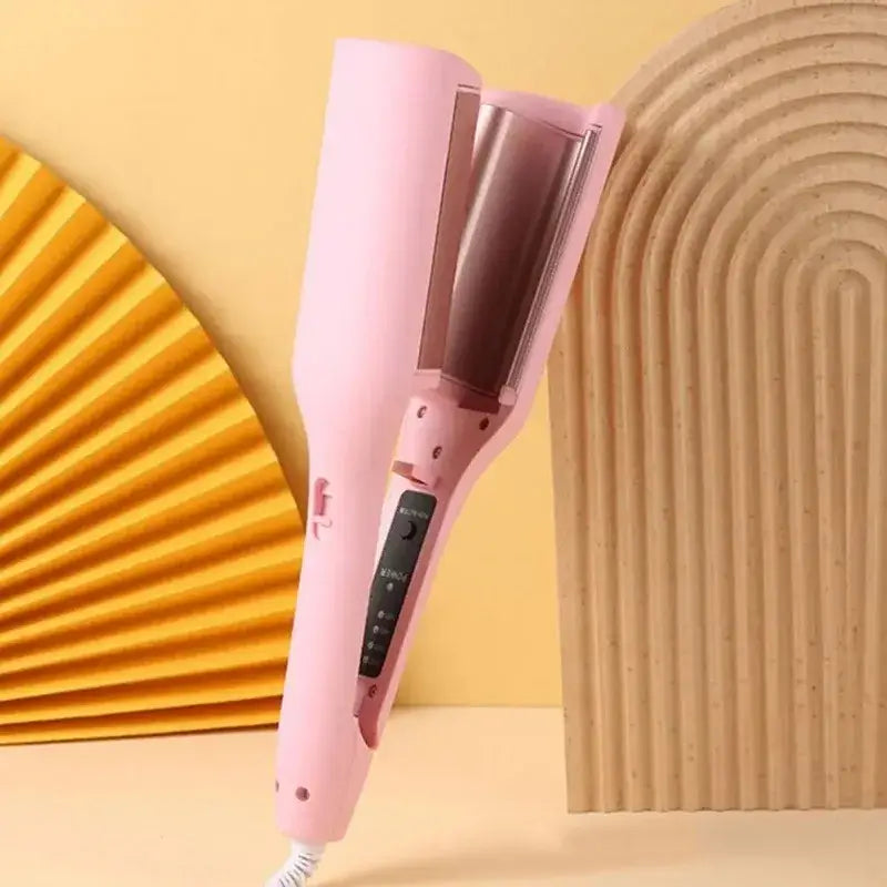 Pink hair curling iron or styling tool with a cylindrical barrel.