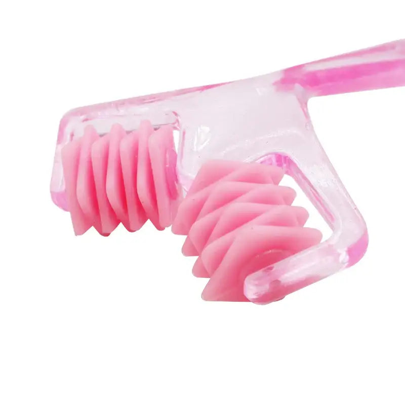 Pink plastic razor with multiple blades for shaving.