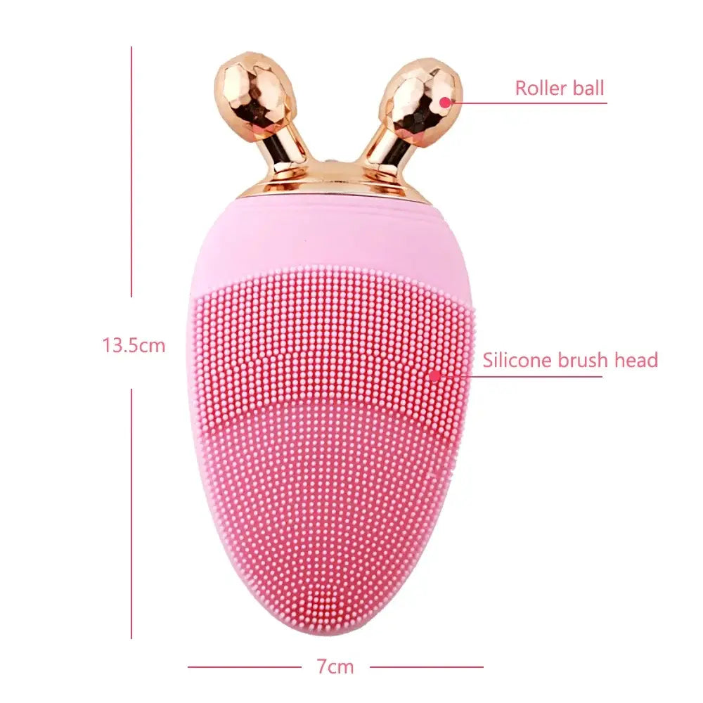 Pink silicone facial cleansing brush with gold-colored roller balls on top.