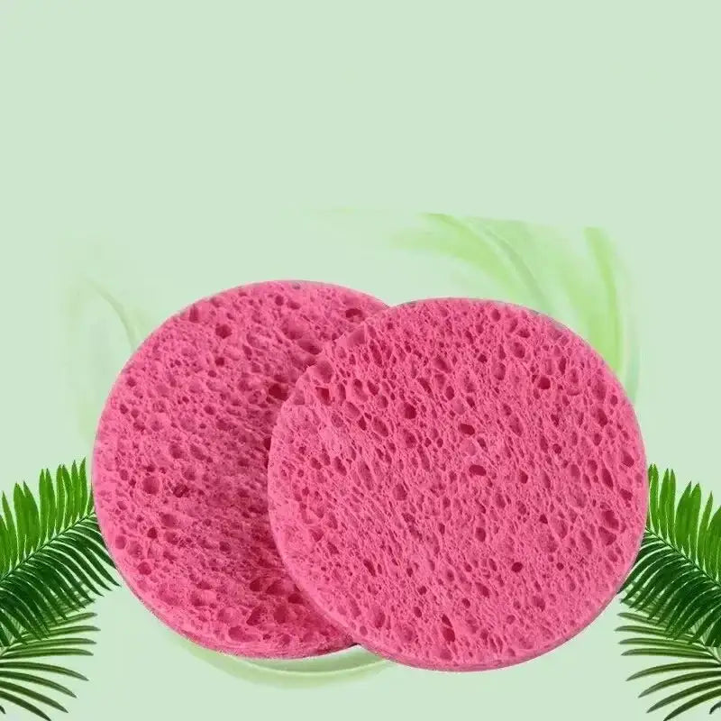 Two round, pink, porous sponges.