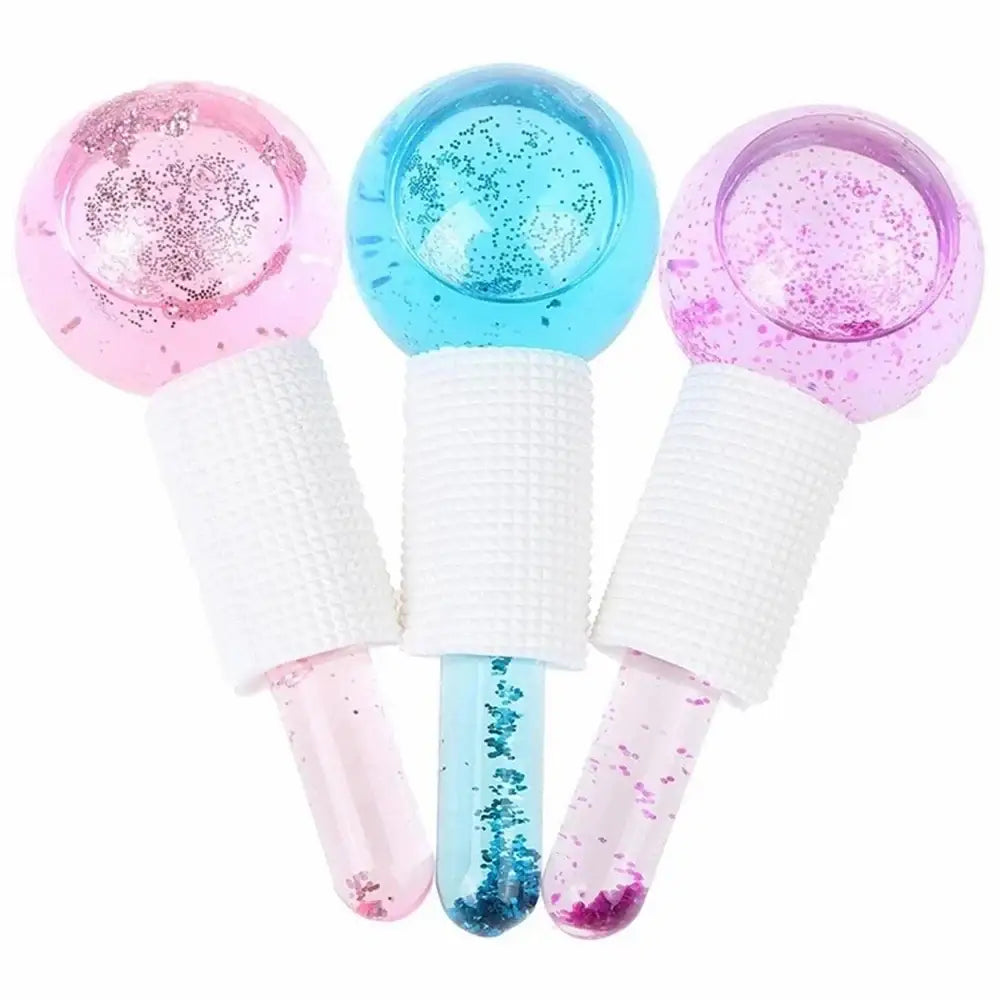 Colorful lollipops with glittery spherical tops and translucent stems containing sparkly liquid.