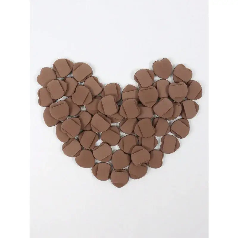 Heart shape formed by chocolate buttons or discs.