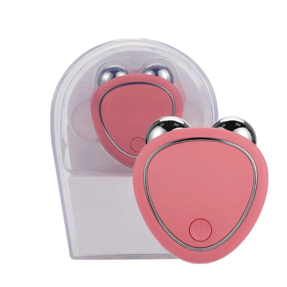 Pink heart-shaped electronic device with metallic accents resembling a cute animal face.