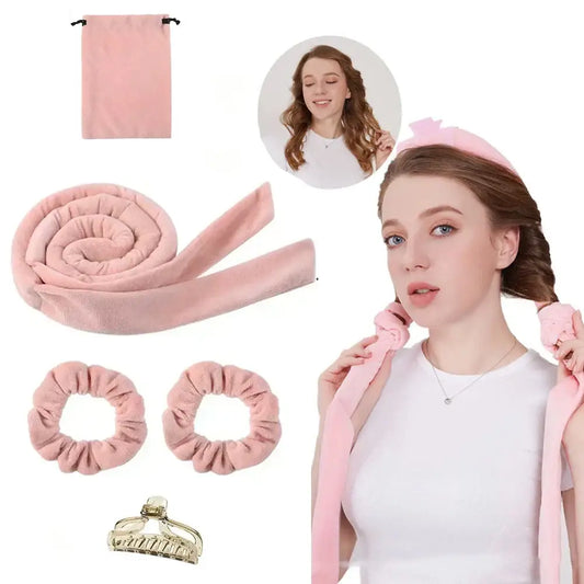 Pink heatless hair curler set with accessories including scrunchies, a claw clip, and a protective bag.