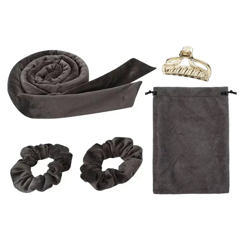 Dark gray silk or satin hair wrap with matching accessories including scrunchies, a drawstring pouch, and a decorative hair clip.